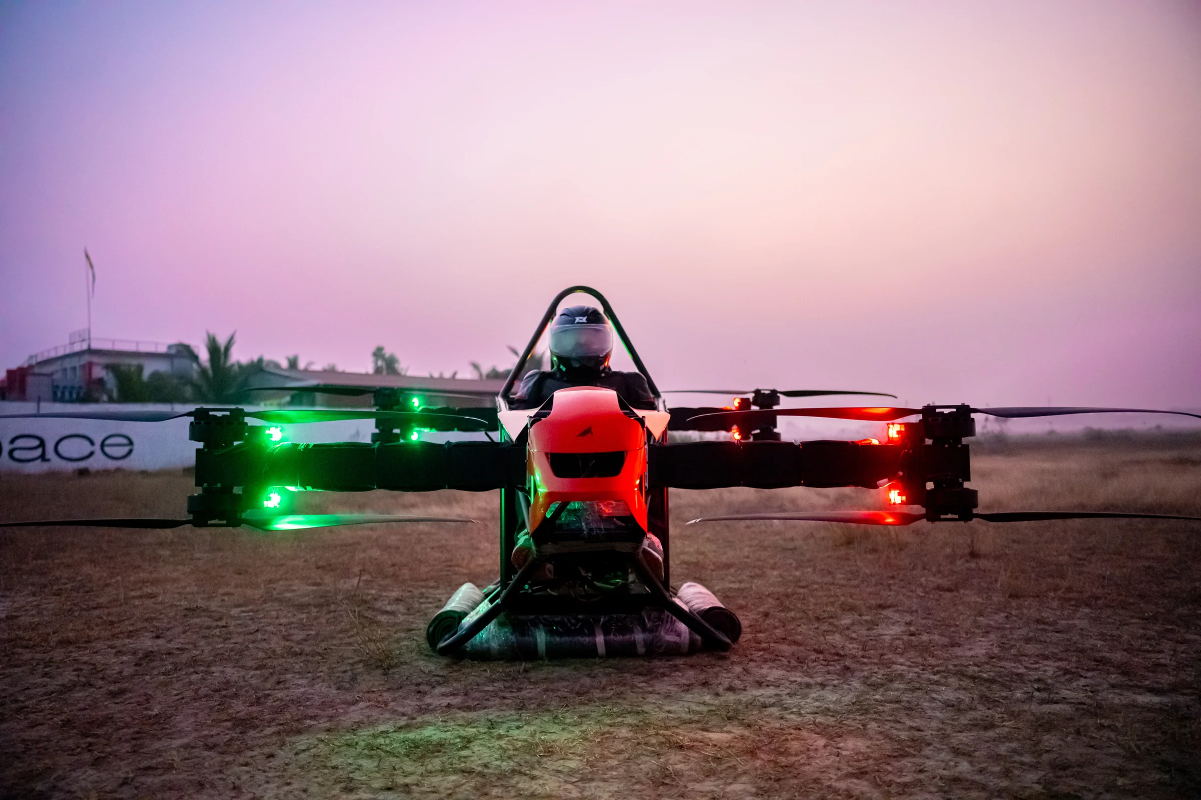 Front view of Genesis with its pilot and illuminated propulsion arms