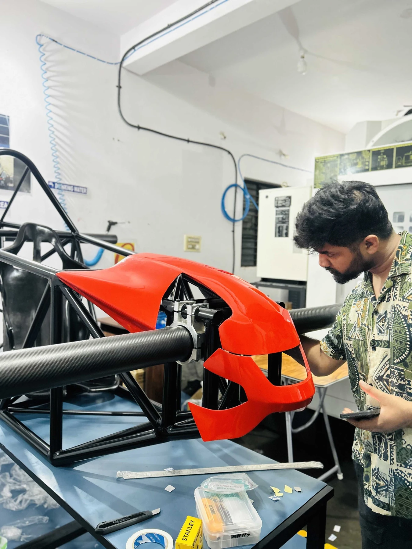 An Aexo designer checking the front casing of the Genesis aircraft